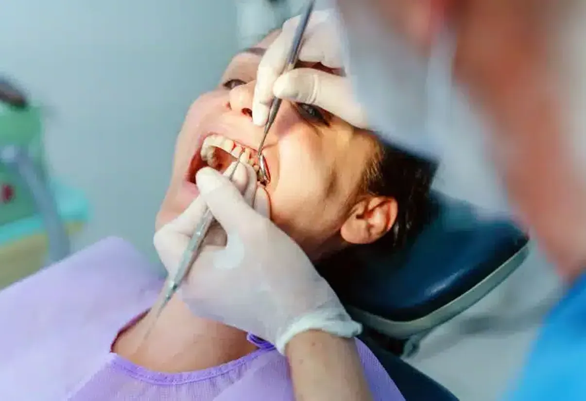 Happy patient pointing to smile